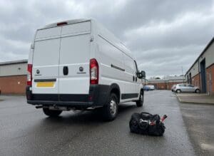 Fiat Ducato van parked on an industrial estate, rear three-quarter view