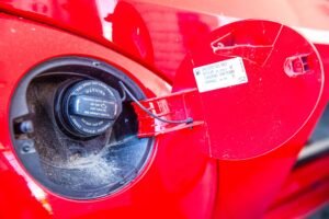 AdBlue in diesel tank: fuel filler cap on a diesel vehicle at a forecourt