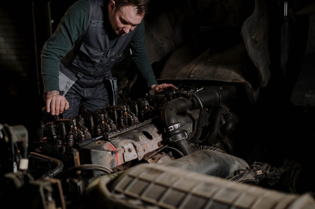 Mechanic checking a used diesel van's AdBlue and SCR system before purchase