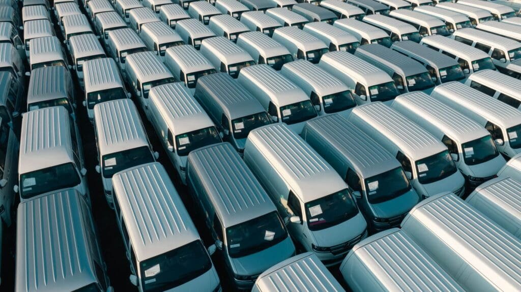 Fleet AdBlue faults: row of white commercial diesel vans in a UK depot yard